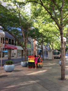 Family playing the piano on 16th Street Mall, Denver